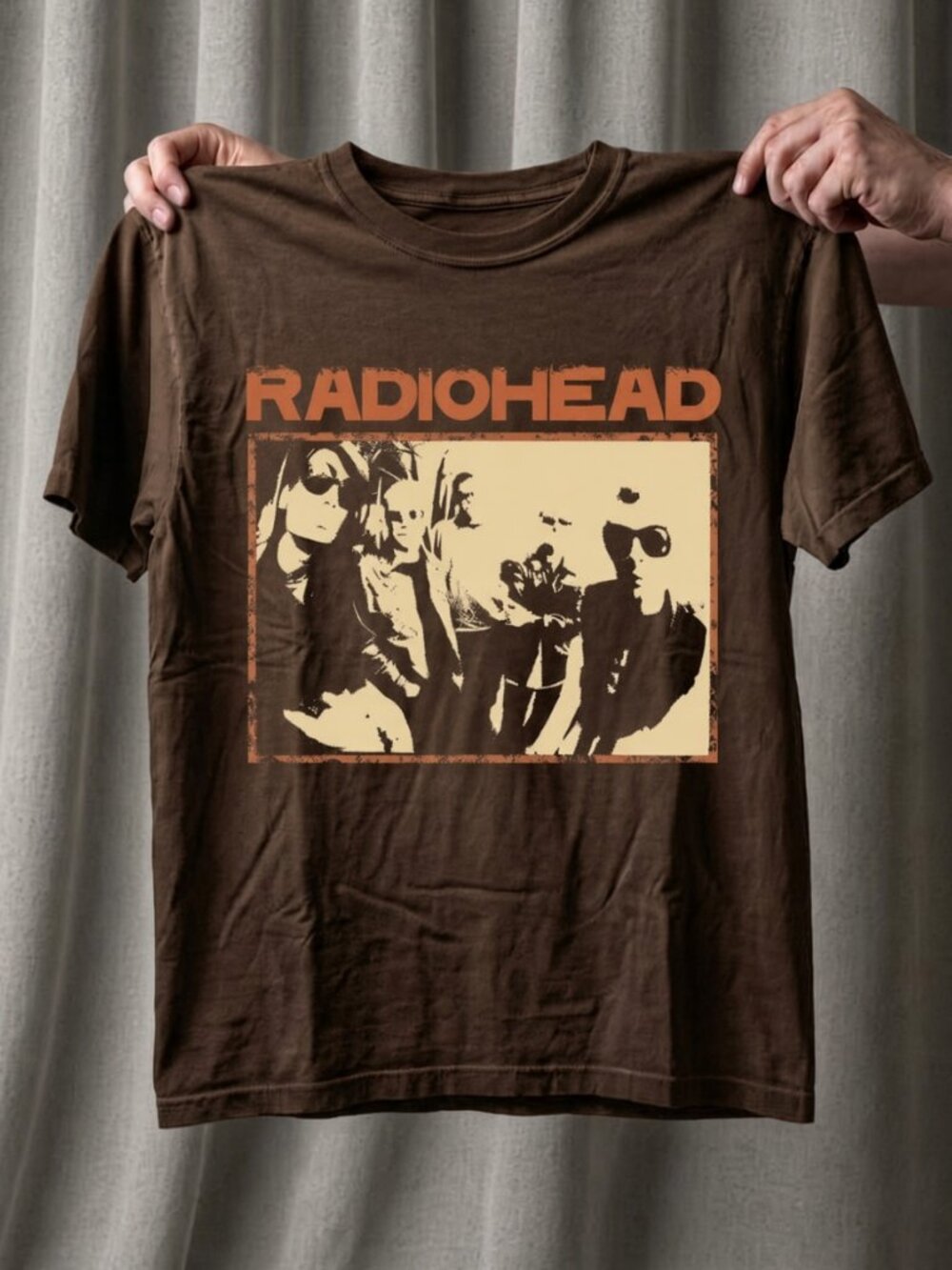 Original bandtee illustration, orange–cream two-tone print on brown tee